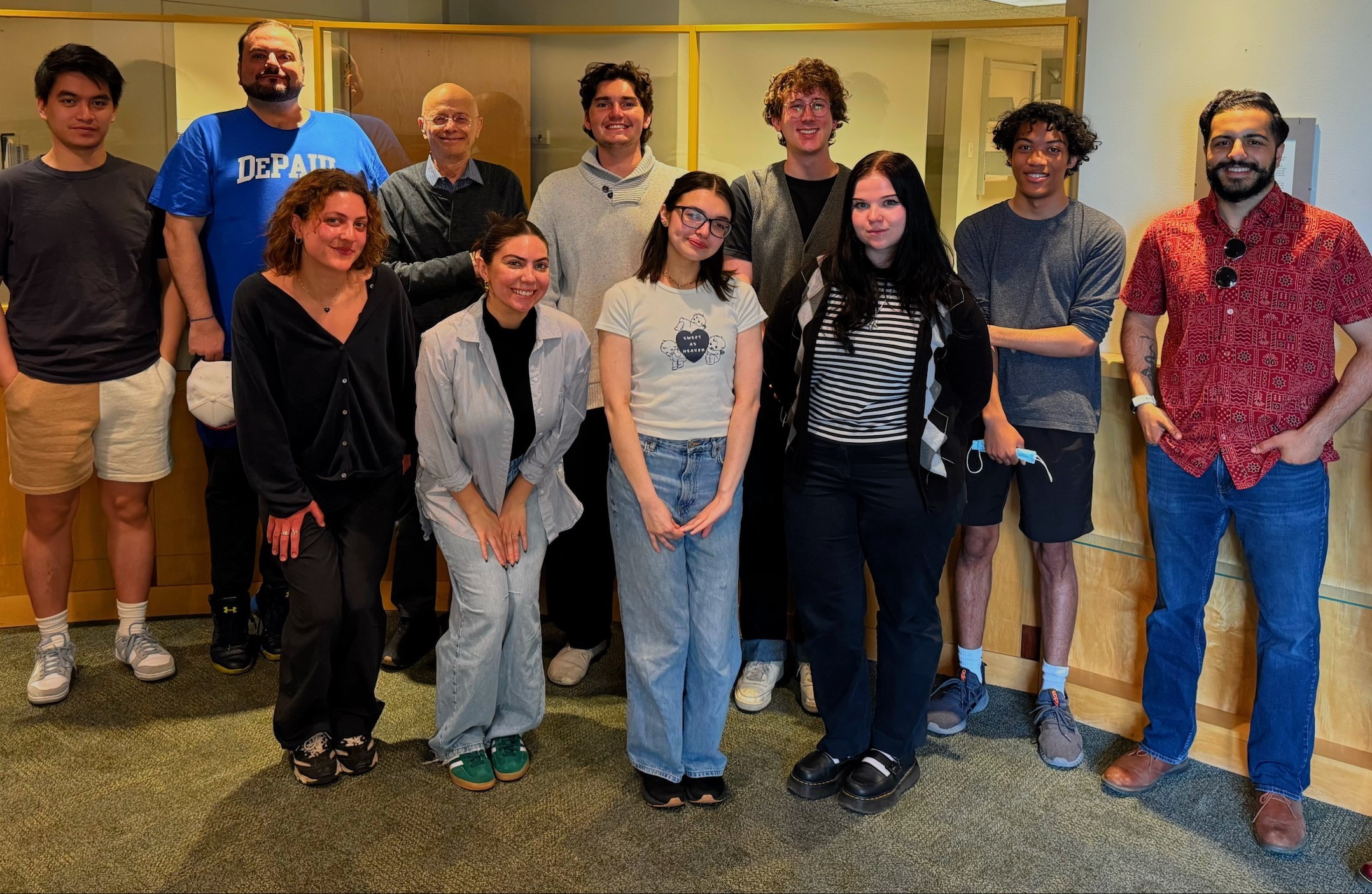 A group of people posing for a photo

AI-generated content may be incorrect.